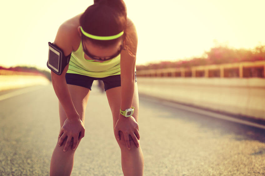 tired woman taking a rest after running