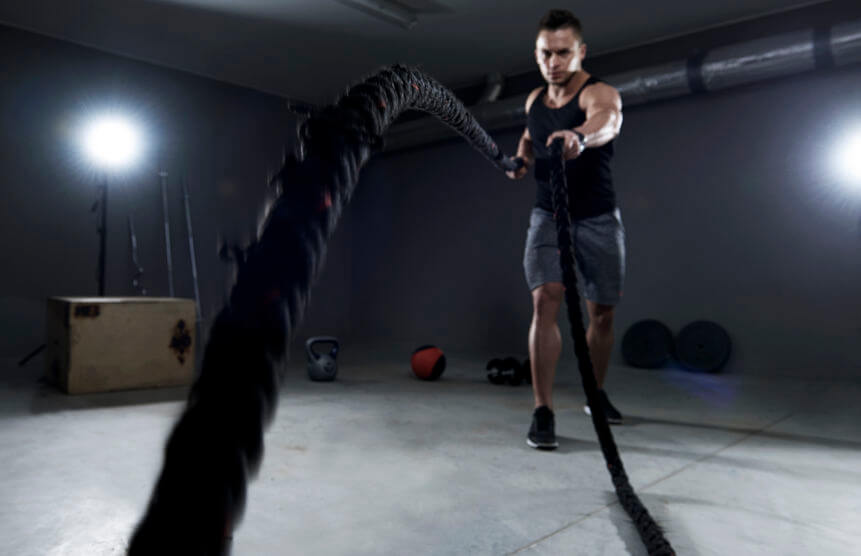 Battle ropes exercise in the garage gym