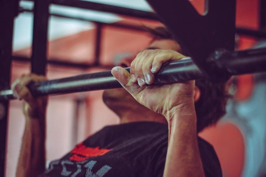 man doing pull up workout