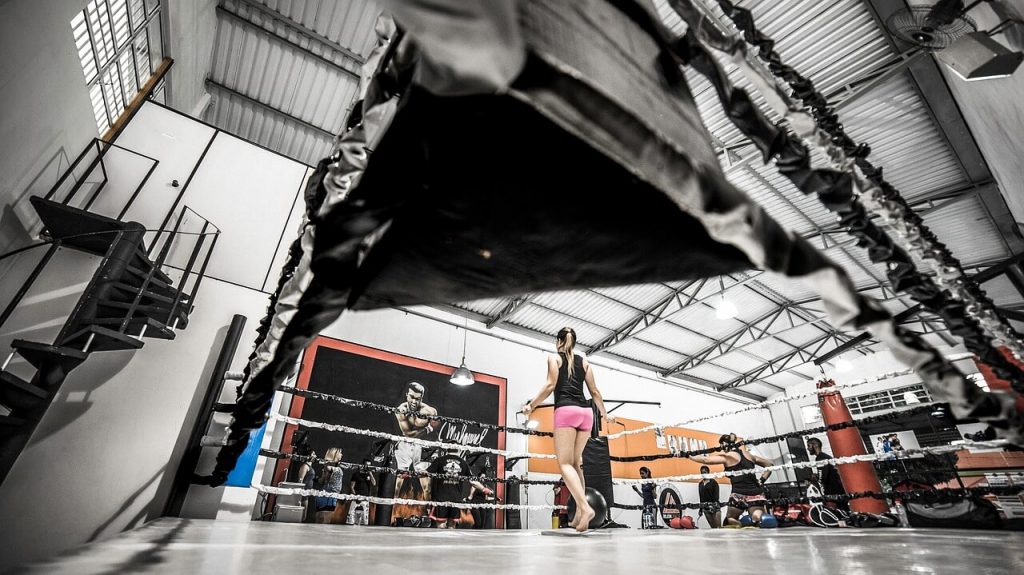 girl workout in boxing ring at crossfit gym