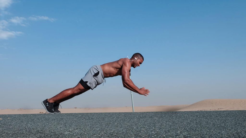 man doing push ups in outdoor