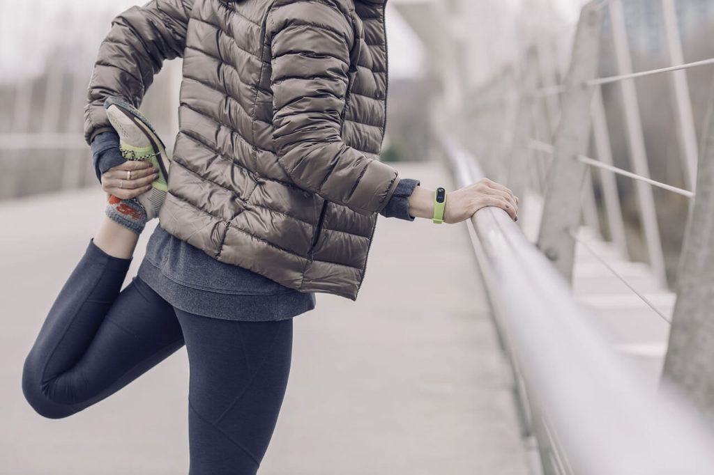 female runner stretching