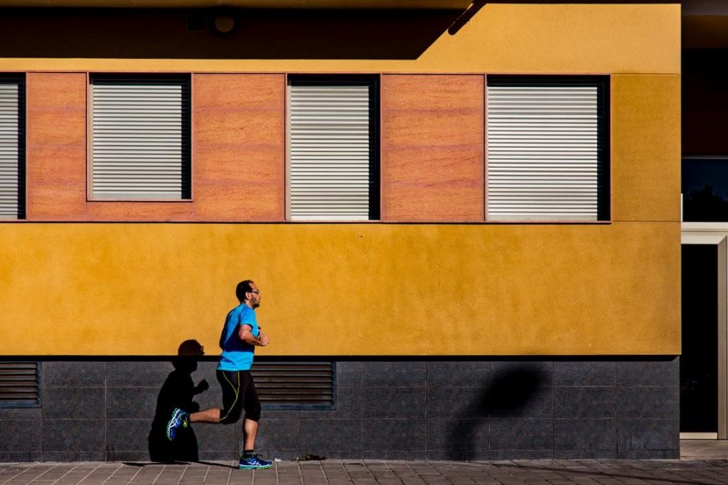 man running in town