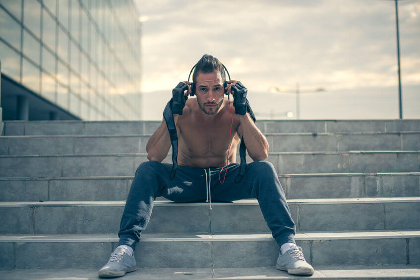 man athlete listening music with headphones