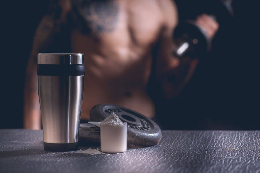 protein shaker, Whey protein powder and dumbbells