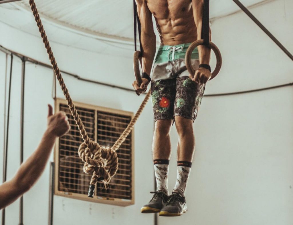 Man doing crossFit workout and wearing shorts