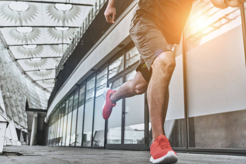 Close up of runner wearing minimalist shoes