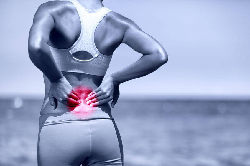 athletic running woman with back pain