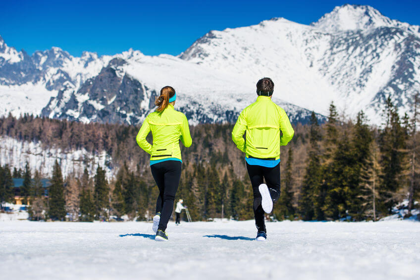 couple jogging outside in winter