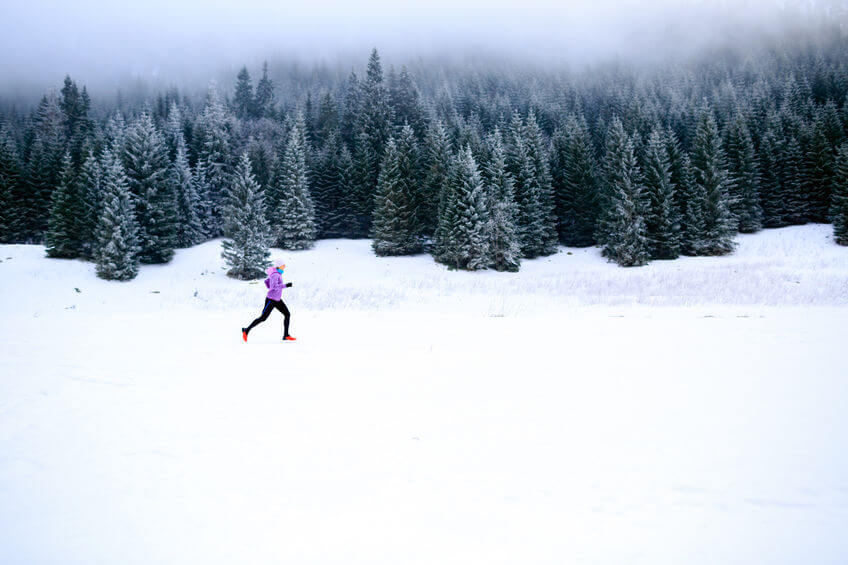 cross country running in mountains on snow