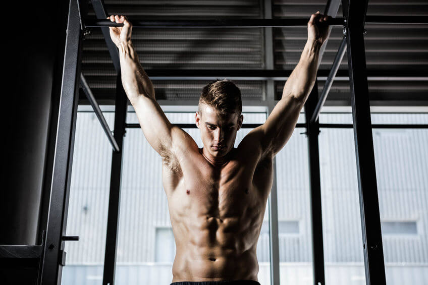 man doing pull up exercise at the CrossFit gym