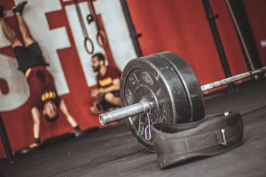 CrossFit gym and barbell on ground