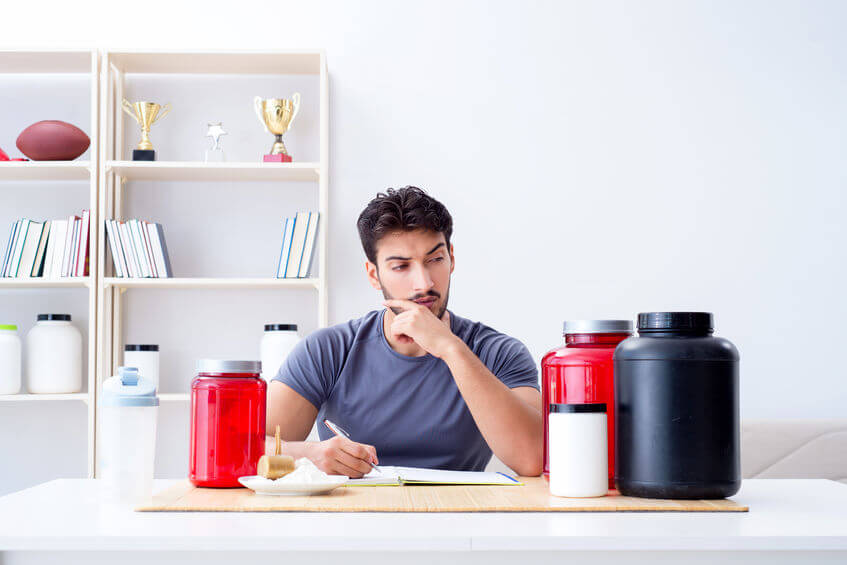 athlete tasting different fitness supplements