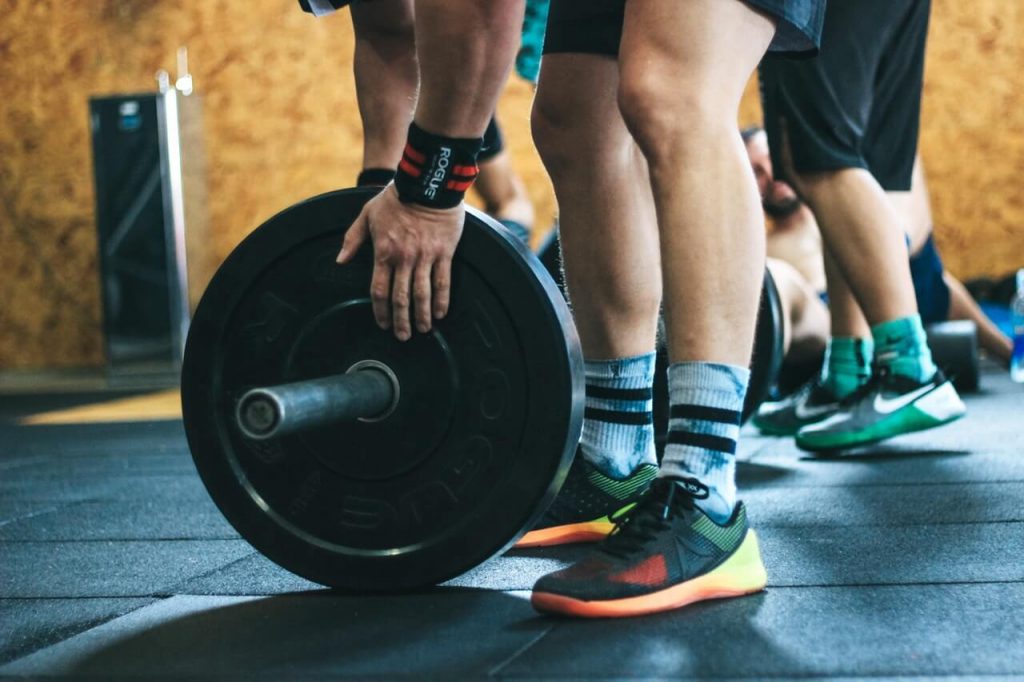 man training with barbell