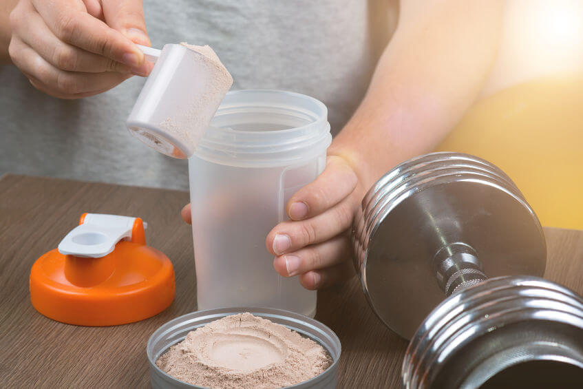 man preparing a protein shake