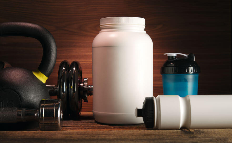 white jar with whey protein powder