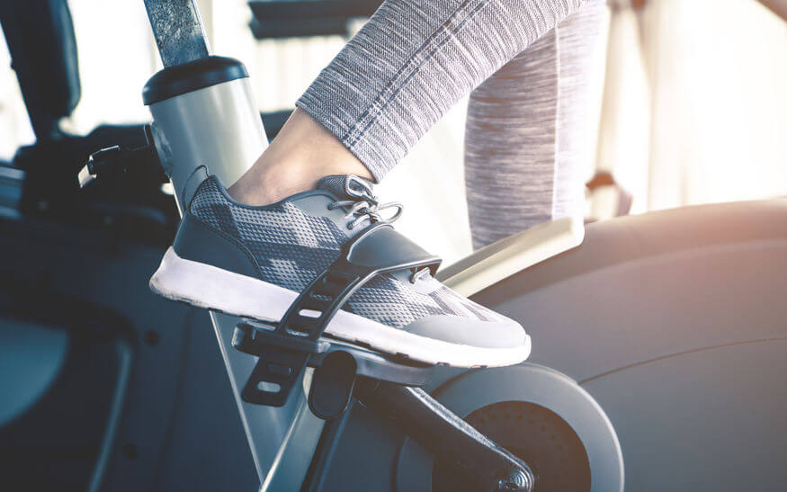 woman foot close up - using indoor exercise bike