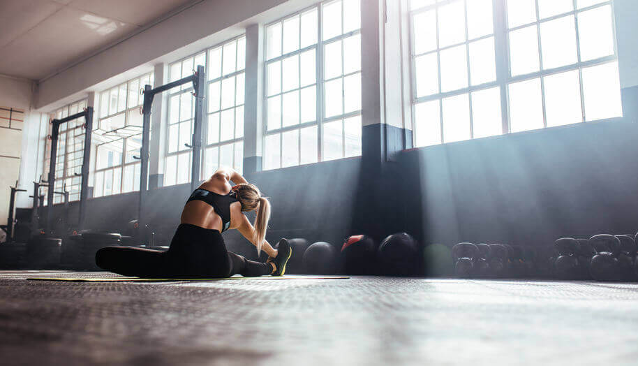 young woman working out in gym