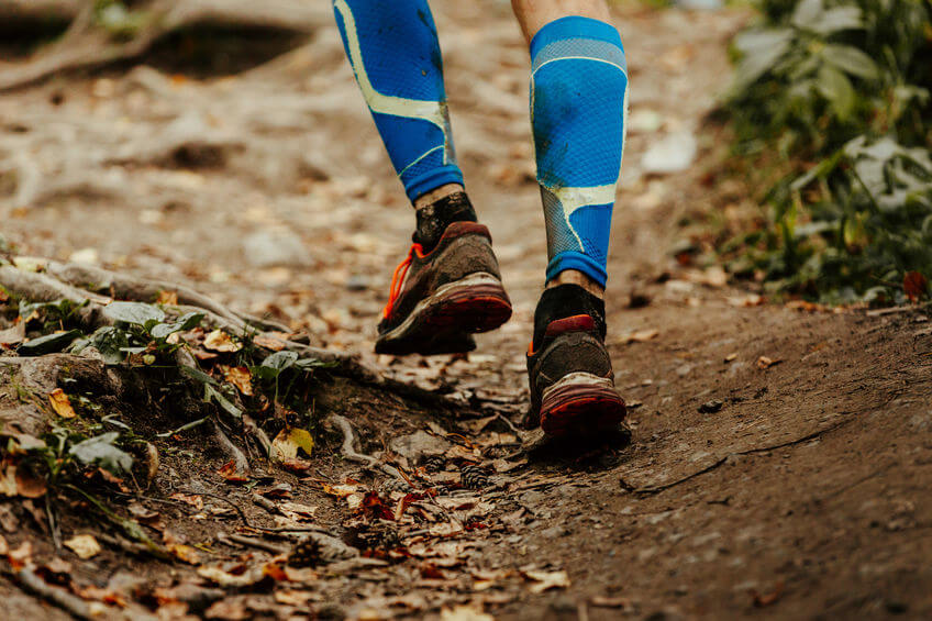 trail runner wearing compression calf sleeves