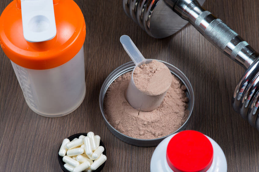 whey protein, creatine pills and shaker